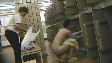 Fat brunette shows off her ass in the locker room