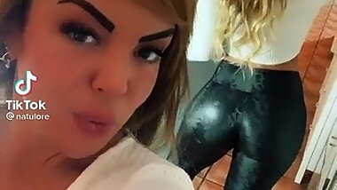 Brunette in leather snake legging